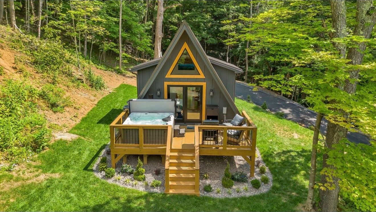 Aerial view of the finished A-frame cabin and its deck