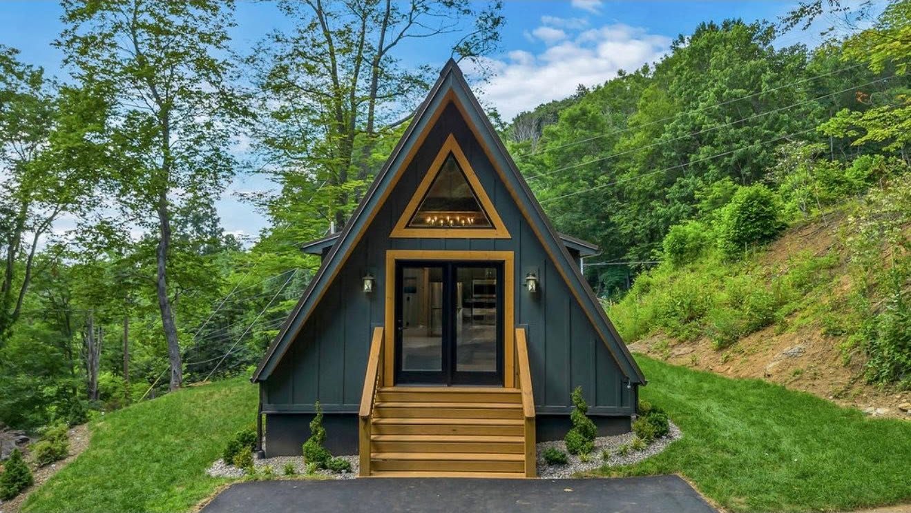 A finished A-frame cabin built by C Sharpe Construction in Ashe County